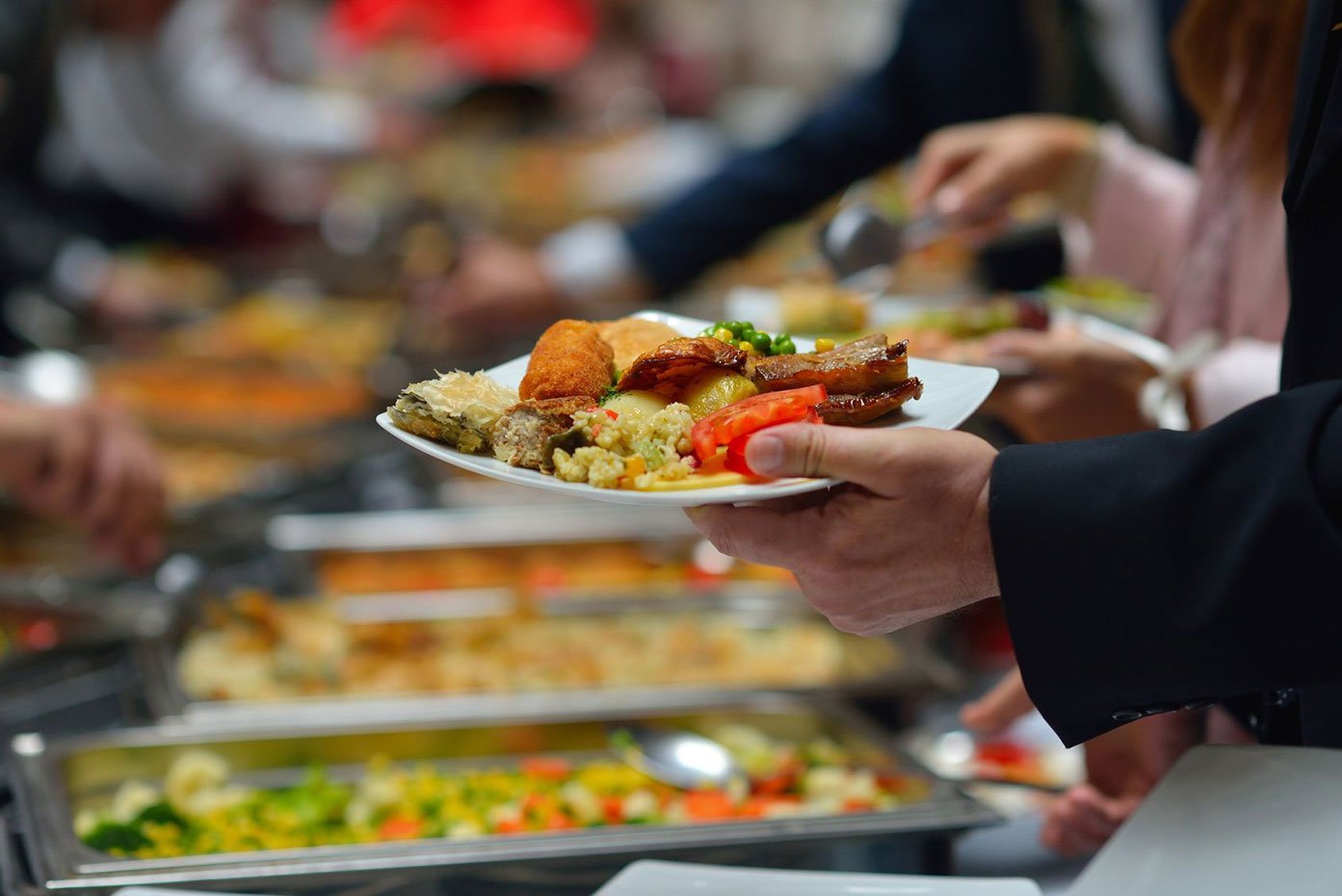A long table at Sthan spread with shared dishes
